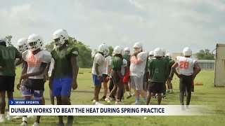 Dunbar High School works to beat the heat during spring practice