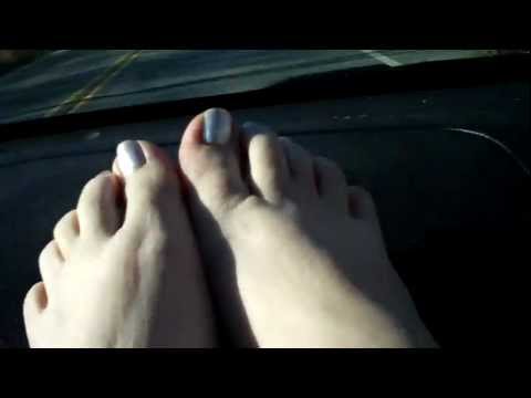 feet on a car dashboard