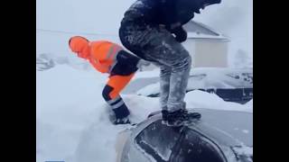 Shirtless men go snow-diving after blizzard in Sakhalin, Russia