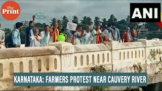 Karnataka: Farmers stage protest near the Cauvery River in Mandya