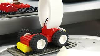 Student uses robot to build Lego car