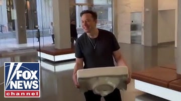 Elon Musk shows up at Twitter HQ: 