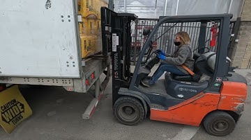 How do you unload a trailer with no dock or ramp?