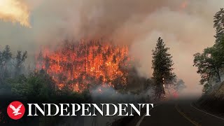 California wildfire burns 30,000 acres of national forest as nearby town is evacuated