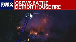 Crews battle large Detroit house fire