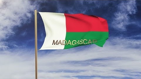 4K Madagascar flag with title waving in the wind. Looping sun rises style. Animation loop Stock