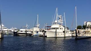 Sailboat docks next to Nordhavn 47