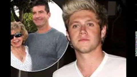 Caroline Flack gets lippy as she leaves the X Factor studios following Simon Cowell's phone ban