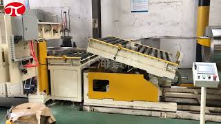 horizontal packing line with coil tilting, wrapping and stacking