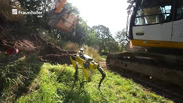 Autonomous excavator ALICE with its robotic companion Spot
