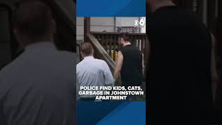 Kids, cats, feces and garbage found in apartment, police say