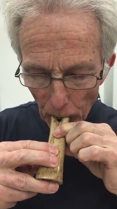 Jelle Atema playing Neanderthal flute replica made with 50-100,000 year old cave bear fossil at AMNH