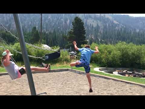 Allfails boy in blue jumps off swing falls off