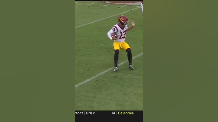 Caleb Williams stiff arms a Stanford defender