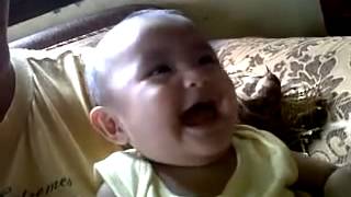 Baby Kim Kea giggling over pellets