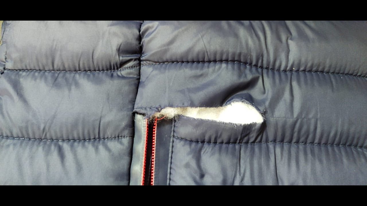 How to fix a hole in a jacket the weird way - YouTube
