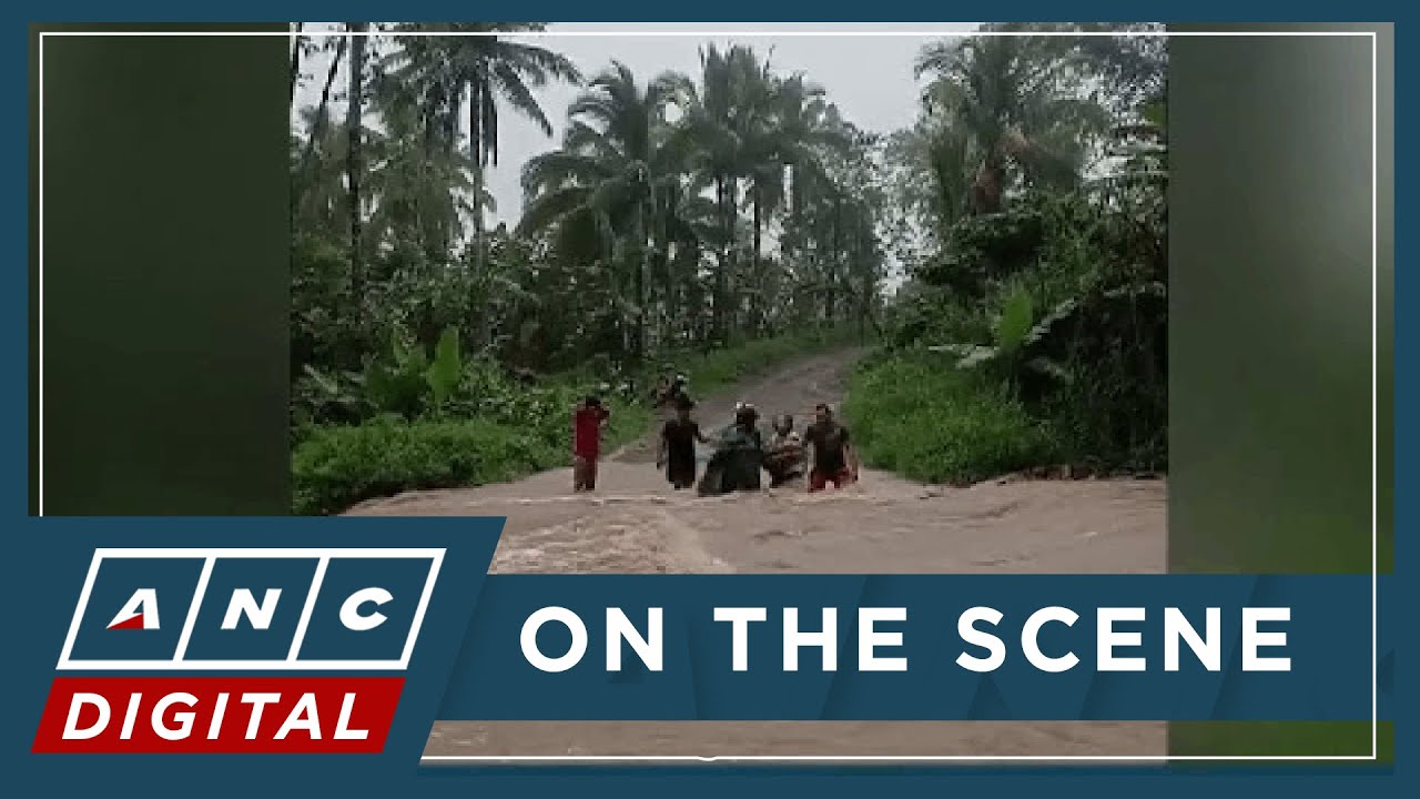 LOOK: Residents struggle to cross floodwaters in Liberty, Ormoc City | ANC