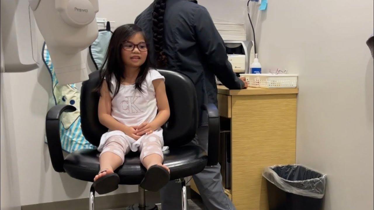 Toddler first tooth extraction at Dentist’s office Laughing gas