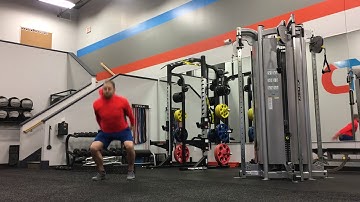 Drop Squat to Jump w/ Stick