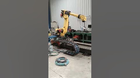 Robot FANUC R2000IB 165F R30IA controller on track at UsedRobotsTrade