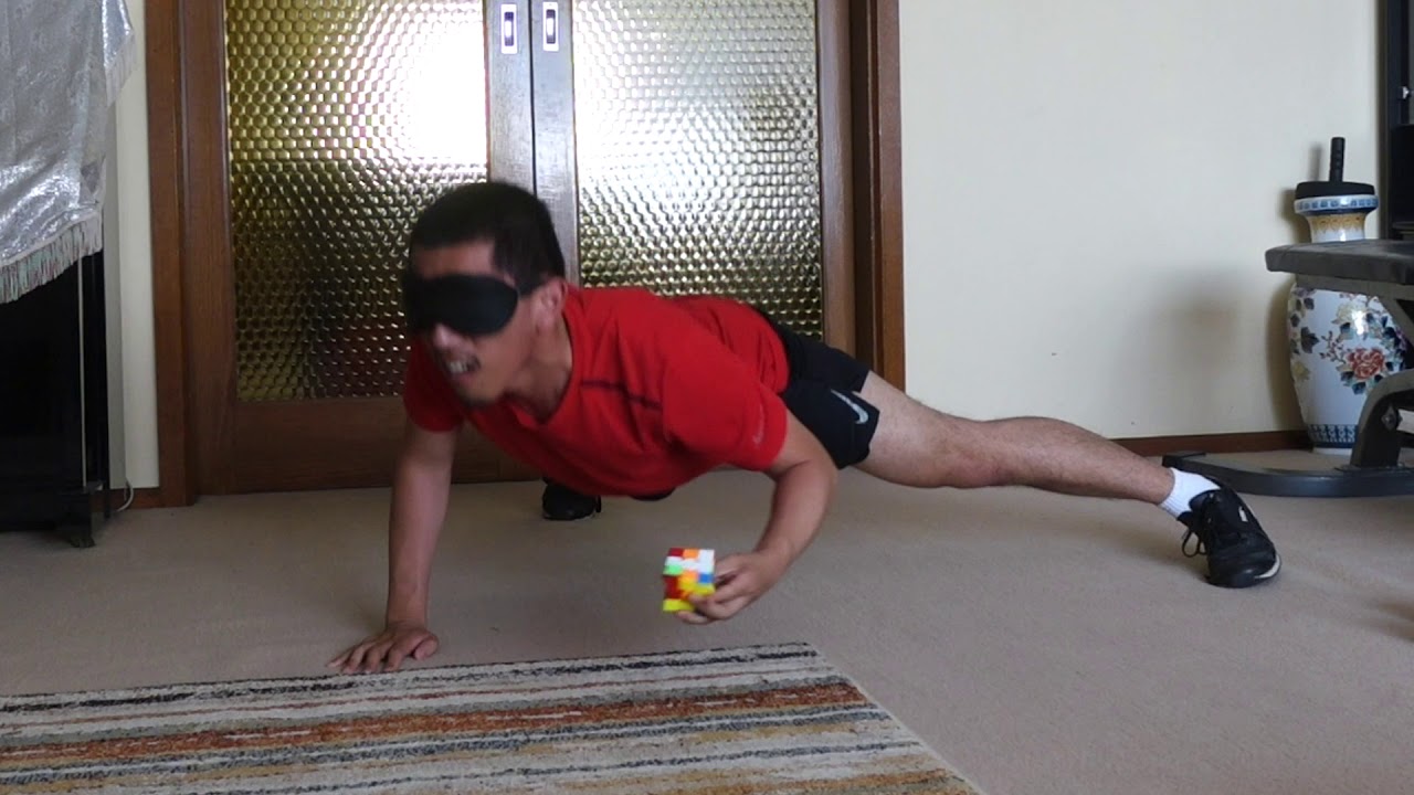 Rubik's Cube Blindfolded One Handed while doing One Arm Pushups