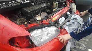 95 Geo Prizm headlight replacement.