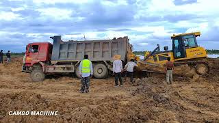 Incredible! Heavy Dump truck stuck in deep mud during pouring soil Recovery byStronger Dozer SHANTUI