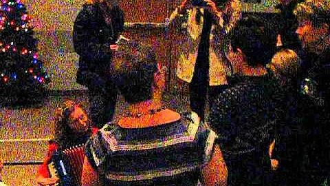 Judy playing accordion for young fan