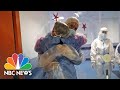 Plastic Hug Wall Brings Joy To Italian Covid Patients | NBC News NOW