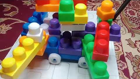 Vlad and Niki play with colored toy blocks and build Three Level House