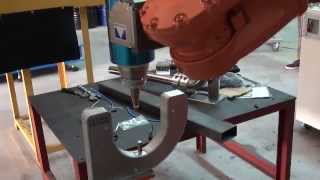 Robotic Laser Cutting Head with Bull's Eye TCP Calibration