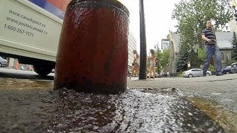 Raw Video: Water flows from downtown Montreal fire hydrant
