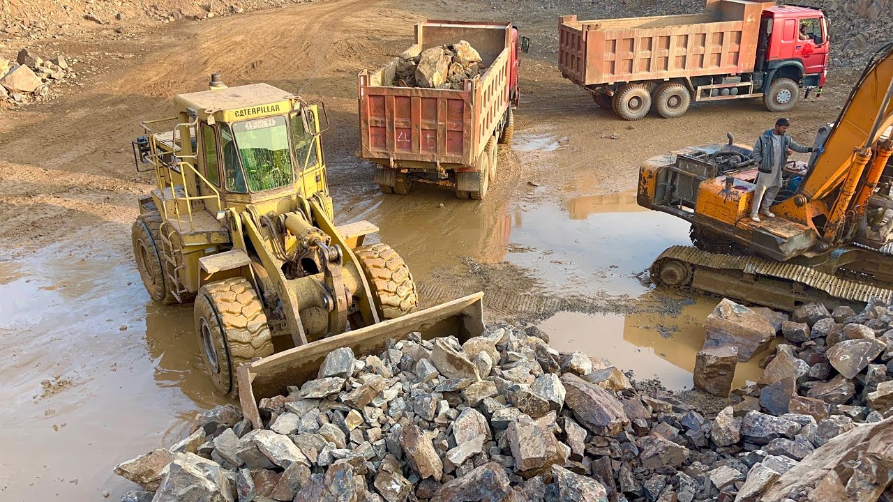 Caterpillar Loader Loading Massive Rocks into Trolley “ Dumper Truck | Heavy Equipment Action