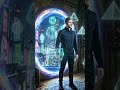 Floating holographic geometric shapes drift out from the glowing portal. #time #future #shorts