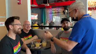 Brad Fuhr, GayDesertGuide's publisher, talks with patrons at Streetbar Palm Springs