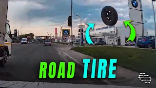 Driver Avoids a Loose Tire Rolling across the Road