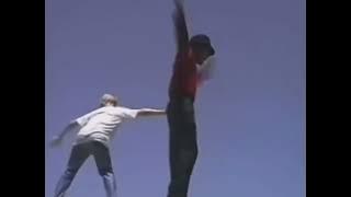 Macaulay Culkin pushes Michael Jackson off diving board, 1989