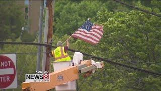 Tattered American flags flying in Hamden before Memorial Day