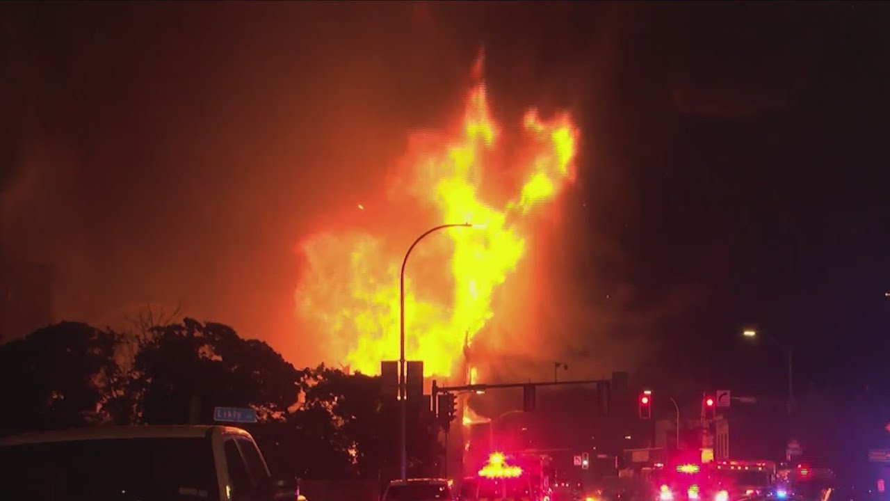 Five-alarm fire causes partial collapse of old Tent City building - YouTube