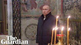 Putin attends Orthodox Christmas service alone