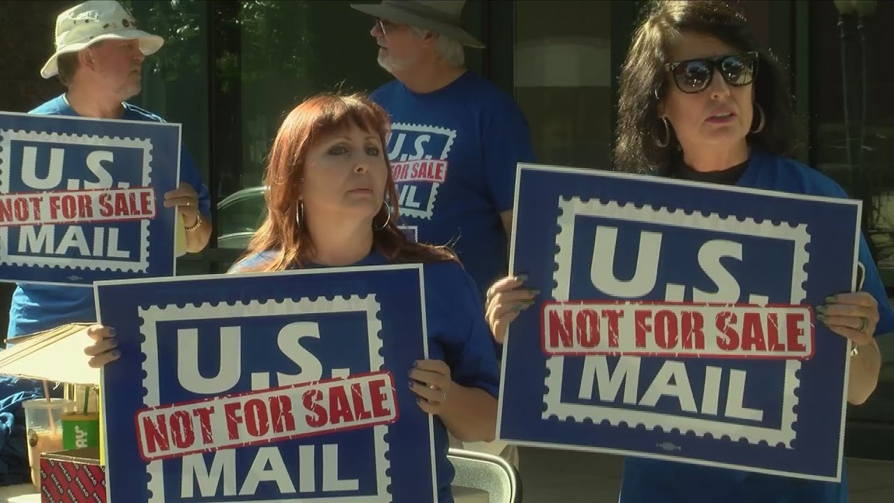 U.S. Postal Service workers protest against Trump's "privatization