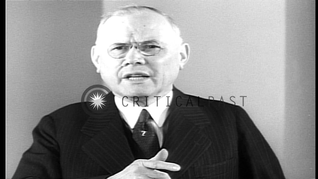 A man explains the terms of settlement of a sit down strike by General Motors wor...HD Stock Footage