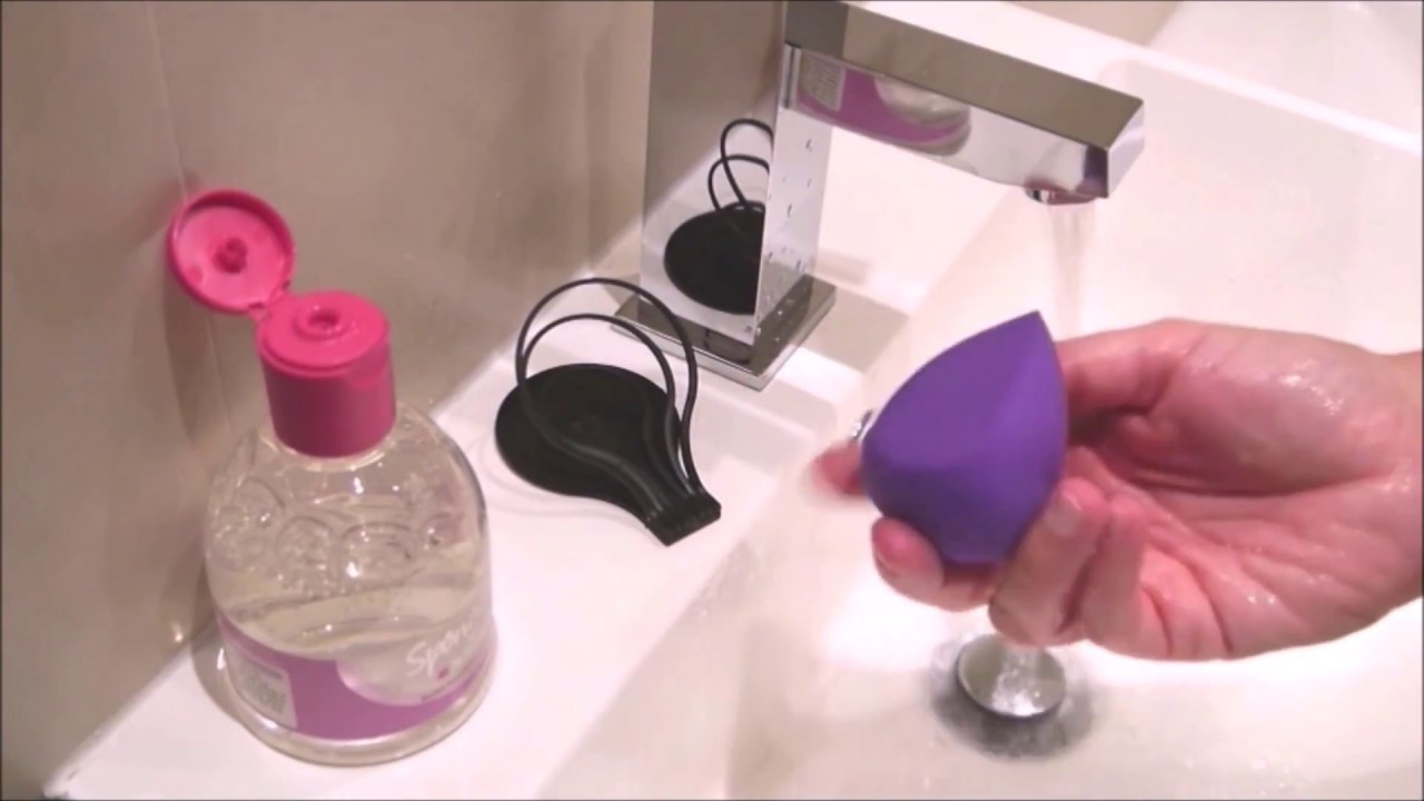 Up close cleaning your blender with Spongeclean liquid foundation blender cleanser