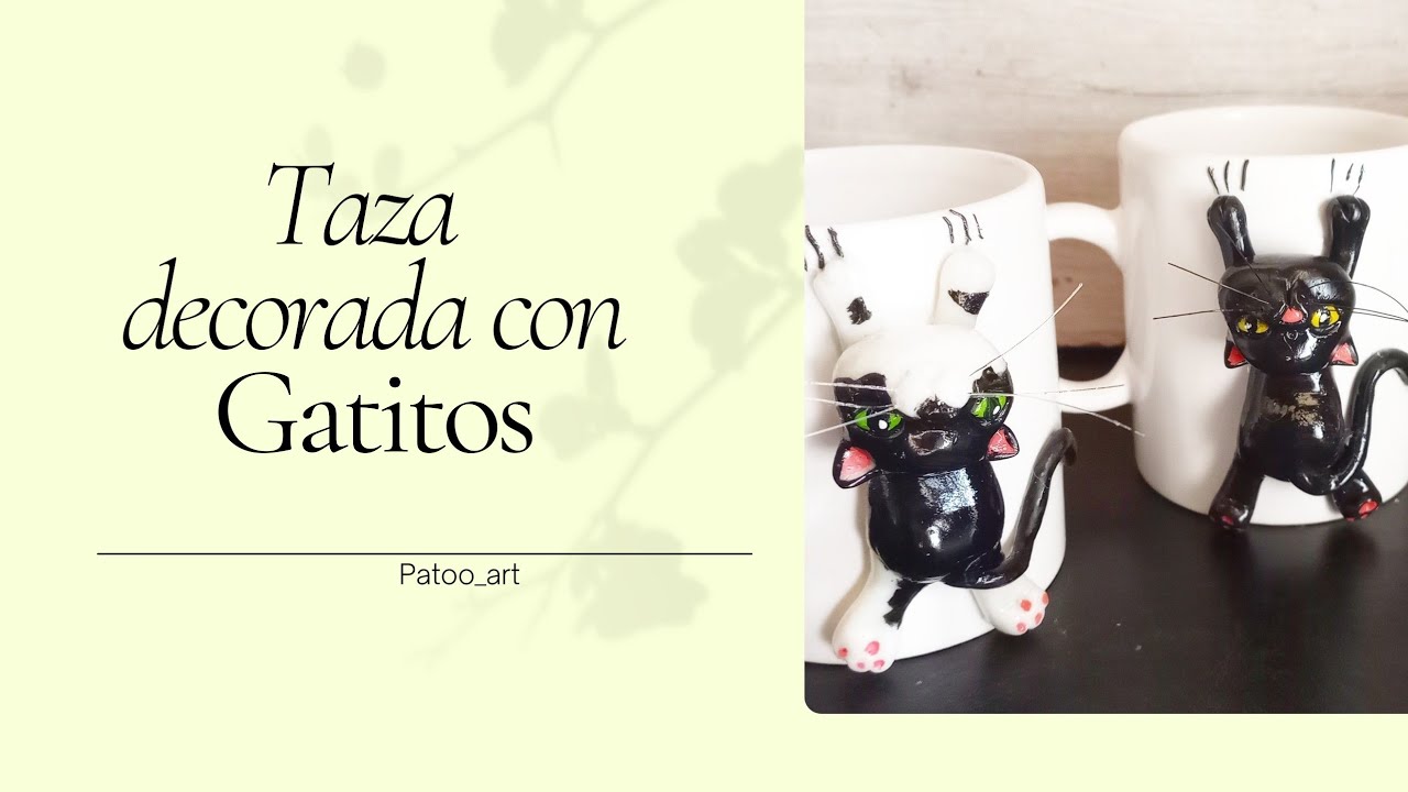 Gatitos en porcelana fría, colgando de una taza