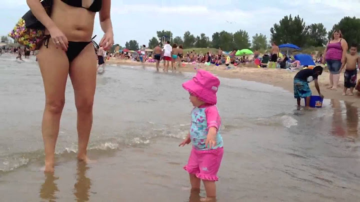 Olivia takes her first steps into Lake Michigan