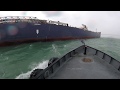 Mail boat pulls along side freighter as storm hits with 40 MPH wind