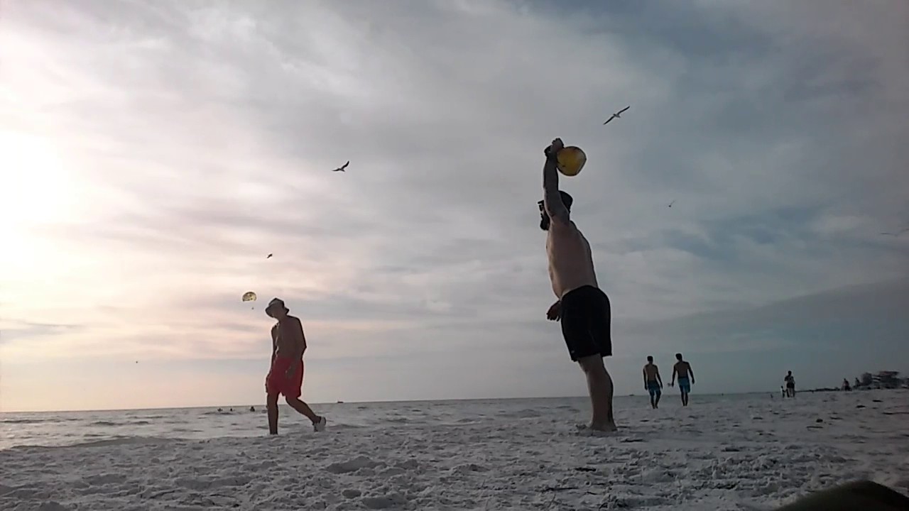 perfect kettlebell swing form Snatches on the Beach ! on Siesta Key Beach 100 each side 16kg For Speed.