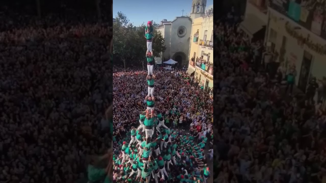 Watch this Human Pyramid. The kid climbing to the top really has some nerves of steel.