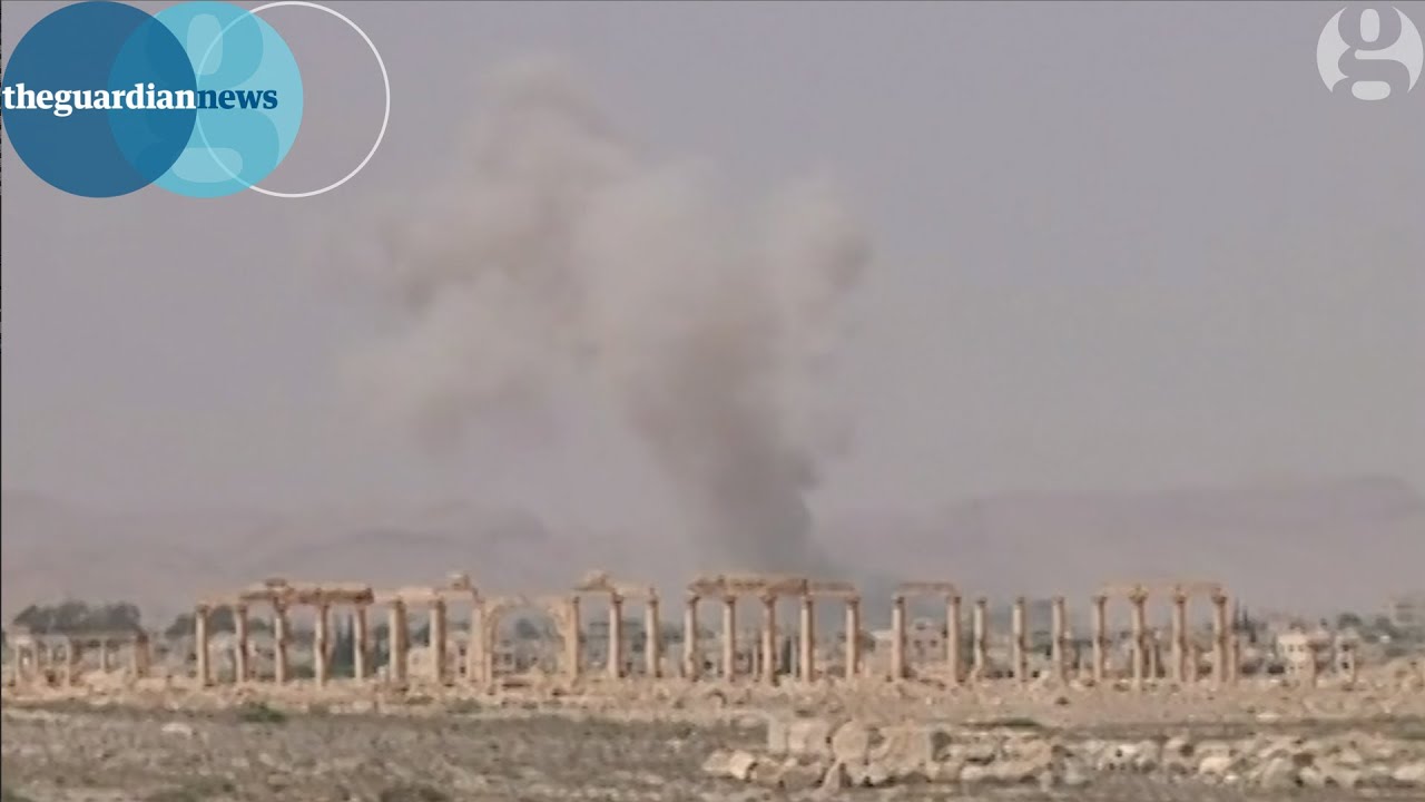 Isis in Palmyra; smoke rises over Syrian ancient ruins