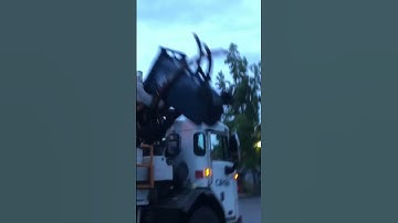 Lid flipping Peterbilt 320 Labrie Automizer on trash